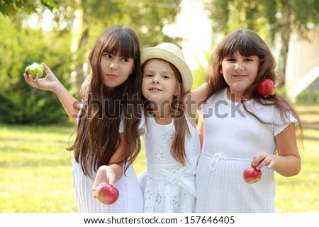 Ethnic group of children outdoors/Adorable happy children on a picnic to play with toys and eat
