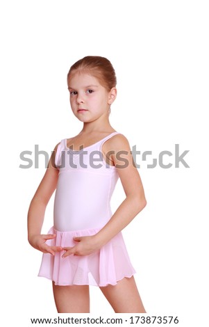 Studio portrait of lovely little girl dressed as a ballerina isolated on white background on Art theme/Happy young ballerina