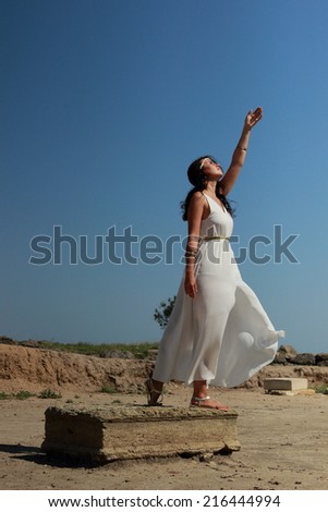 Beautiful fullbody Greek goddess with arms up