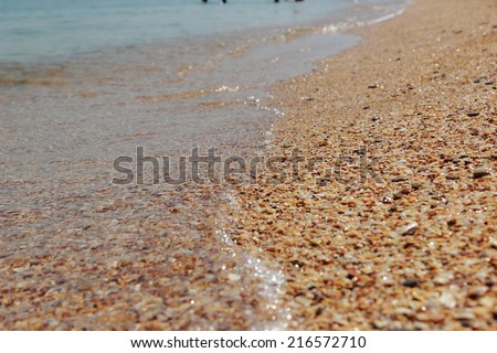 Background of clean sea-water and sand at the bottom