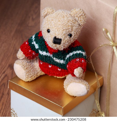 Christmas decoration with antique teddy bear over wooden background on Holiday theme