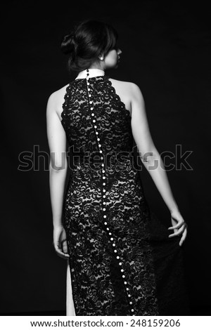 Beautiful brunette with a sweet smile/Black and white art photo of elegant lady