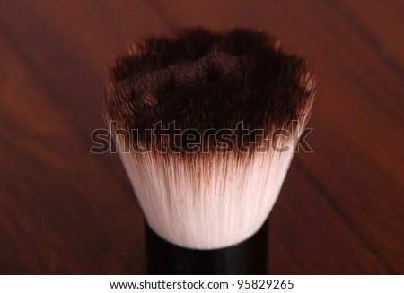 make up brush over dark brown background on beauty theme/make up brush