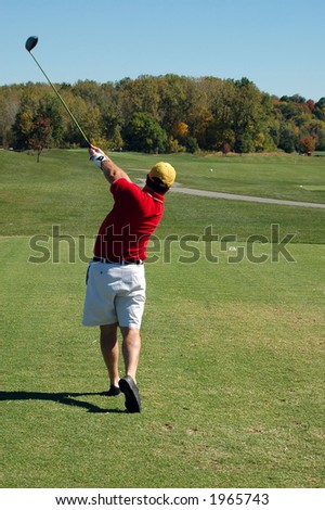 Golf Swing on a beautiful fall day on the course.
