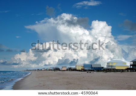 Beach houses in Gulf Shores, Alabama; with cumulus clouds in the background