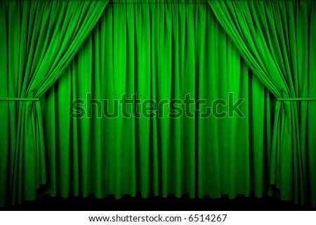 Large Green curtain with spot light and fading into dark.