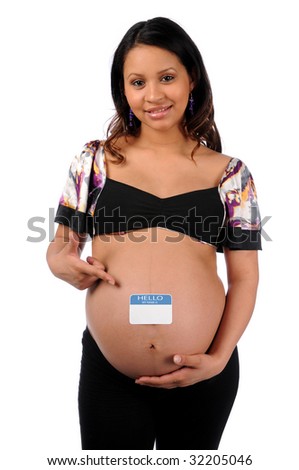 Young Hispanic woman pointing to blue name tag on belly isolated over white
