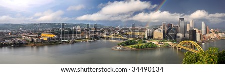 Panoramic view of the city of Pittsburgh with rainbow in late afternoon - LARGE
