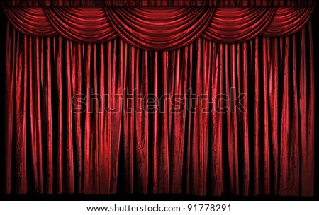 Bright red curtains on stage with lights and shadows