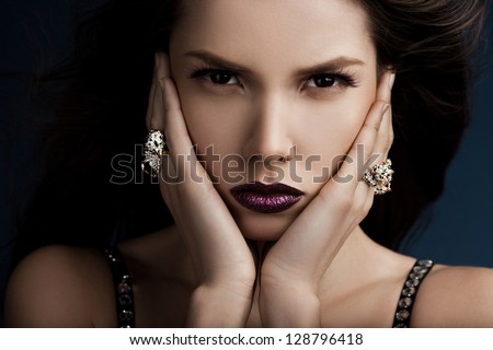 elegant fashionable woman with rings