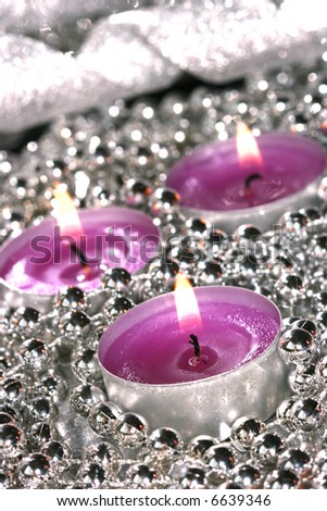 pink candles with silver decoration balls