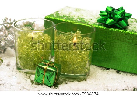 festive new-year candles and gift box with snow