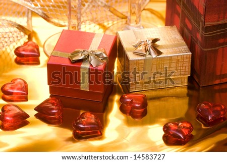red and gold gift box with hearts