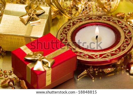 gift boxes and burning candle