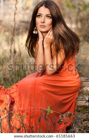 woman in orange dress at the nature