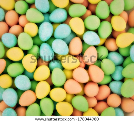 Close up of numerous candy coated chocolate Easter mini eggs. Softly diffused.