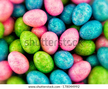 Close up of numerous glitter coated mini eggs.