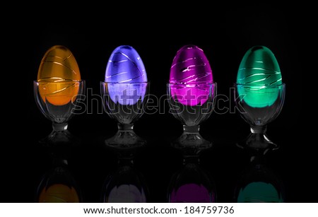 Decorative neon colored Easter eggs in cups in a row on a Black background.