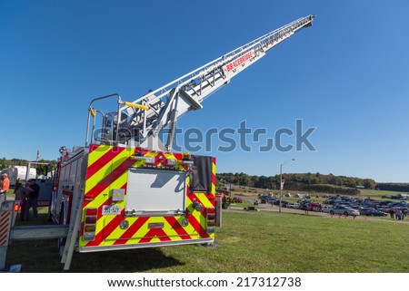 BRACEBRIDGE, CANADA - September 14, 2013: A fire truck with an extended ladder at the 146th annual Bracebridge Fall Fair and Horse Show.
