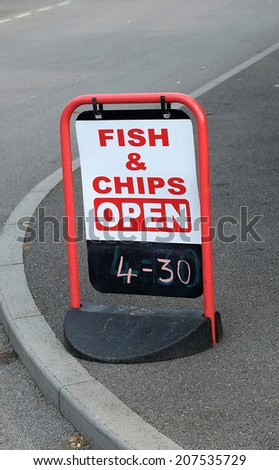 Fish and chip shop opening sign for classical fast food outlet.