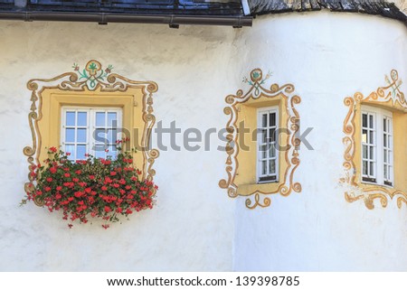 Window with window boxes and painted decoration