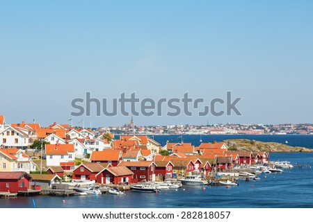 Fiskebackskil an old fishing village on the Swedish west coast, with Lysekil city in the background