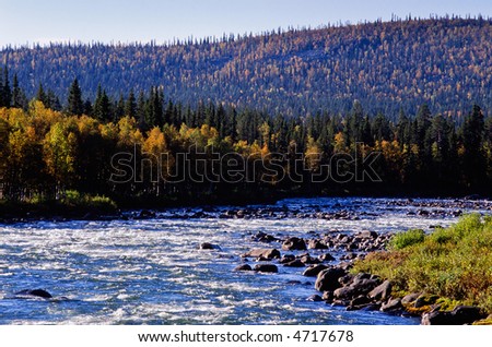 Autumn river float in the landscape
