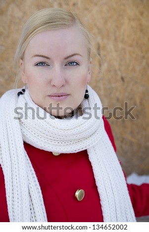 Zoomed young woman face watch focused on camera