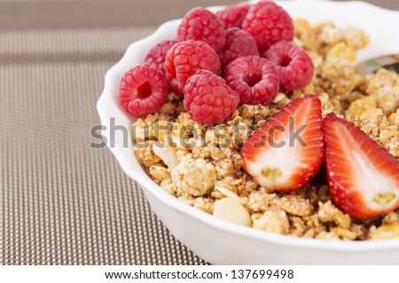 Zoomed view on golden cereals with berries half