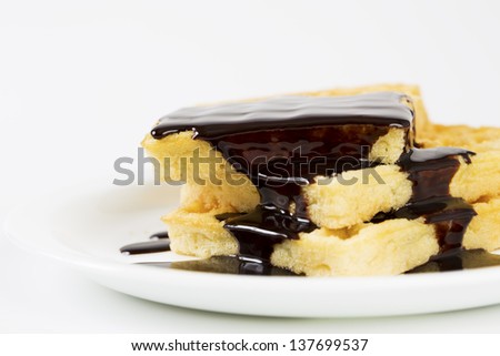 Zoomed wafers poured over by melted dark chocolate