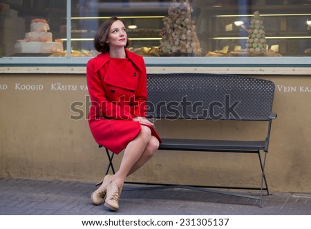 Young woman waiting her friend looking at sky