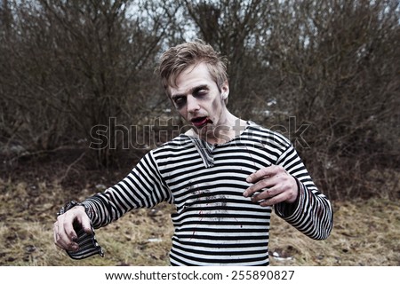 Creepy man with blood and zombie makeup