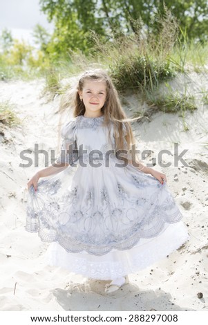 Girl shows her manners on the beach