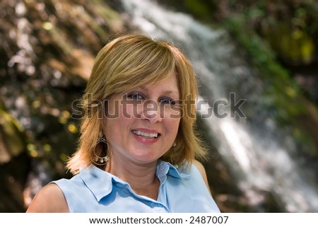 Woman in front of Juney Whank Falls, Great Smokey Mountains National Park.