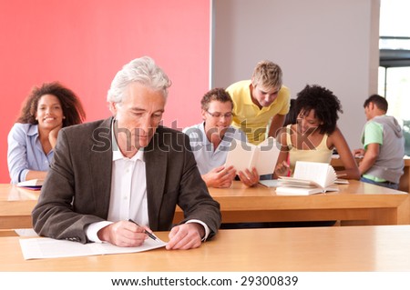 Portrait of University lecturer with students in background