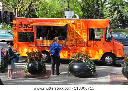 CALGARY, CANADA - SEPT 18: Food Fighter food truck on September 18, 2012 in Calgary, Alberta. The mayor of Calgary has pushed through a new law finally allowing for the popular street meat vendors.