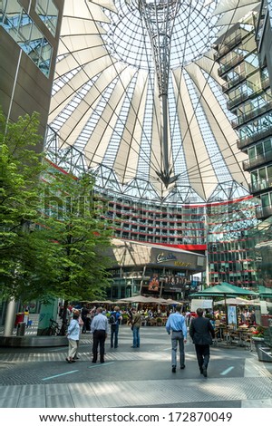 BERLIN, GERMANY - MAY 8: Tourists in Sony Center on Potsdamer Platz in Berlin, Gemany on May 8, 2006. Sony Center is a Sony-sponsored building complex located at the Potsdamer Platz.