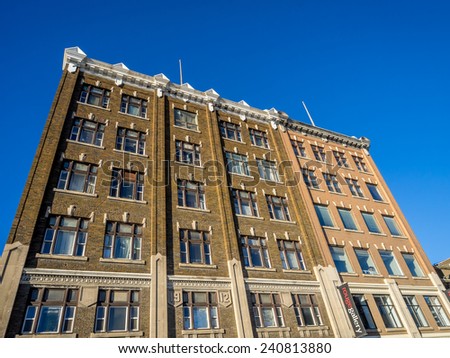 SASKATOON, CANADA - DEC 25: Profile of typical older stone buildings on December 25, 2014 in the urban centre of Saskatoon, Saskatchewan. This building now houses and art gallery.