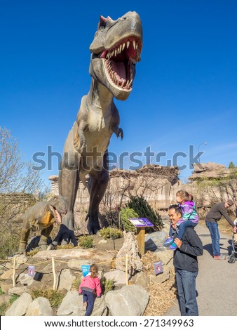 CALGARY, CANADA - APRIL 17: Animatronic Dinosaurs exhibits at the  Prehistoric Park section of the Calgary Zoo on April 17, 2015. The Prehistoric Park section recalls Alberta\'s dinosaur heritage.