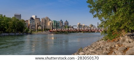CALGARY, CANADA - MAY 24: Peace Bridge and Bow River on May 24, 2015 in Calgary, Alberta Canada. The pedestrian bridge spans the Bow River and was designed by Santiago Calatrava