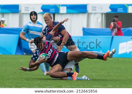NANJING, CHINA-AUGUST 19: Argentina Rugby Team (white/blue) plays against USA Rugby Team (blue) on Day 3 match of 2014 Youth Olympic Games on August 19, 2014 in Nanjing, China. Argentina wins 33-10.