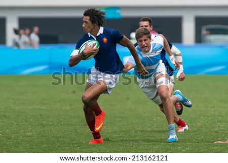 NANJING, CHINA-AUGUST 20: Argentina Rugby Team (white) plays against France Rugby Team (blue) during final match of 2014 Youth Olympic Games on August 20, 2014 in Nanjing, China. France wins 45-22