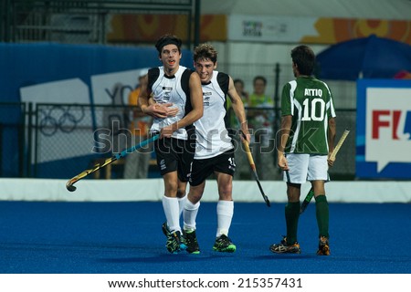 NANJING, CHINA-AUGUST 21: Robbie Capizzi of New Zealand (L) celebrates a goal with team member during Day 5 match against Pakistan at 2014 Youth Olympic Games on August 21, 2014 in Nanjing, China.
