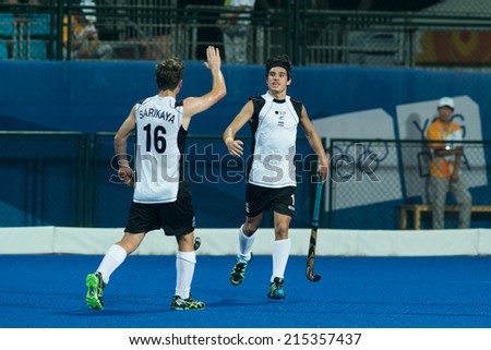 NANJING, CHINA-AUGUST 21: Robbie Capizzi of New Zealand (R) celebrates a goal with team member during Day 5 match against Pakistan at 2014 Youth Olympic Games on August 21, 2014 in Nanjing, China.