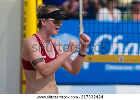 PHUKET, THAILAND-OCTOBER 31: Julia Sude of Germany reacts after winning a point during a match on Day 2 of Phuket Open on October 31, 2013 at Karon Beach in Phuket, Thailand