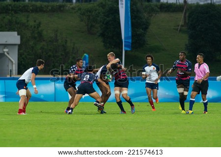 NANJING, CHINA-AUGUST 18: France Rugby Team (white) plays against USA Rugby Team (blue-red) during Day 2 match of 2014 Youth Olympic Games on August 18, 2014 in Nanjing, China.