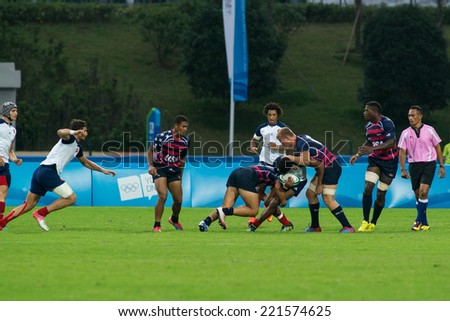 NANJING, CHINA-AUGUST 18: France Rugby Team (white) plays against USA Rugby Team (blue-red) during Day 2 match of 2014 Youth Olympic Games on August 18, 2014 in Nanjing, China.