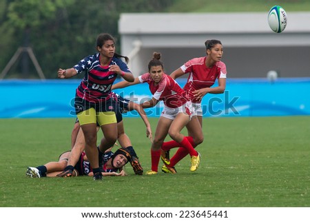 NANJING, CHINA-AUGUST 19: USA Rugby Team (blue) plays against Tunisia Rugby Team (red) during Day 3 match of 2014 Youth Olympic Games on August 19, 2014 in Nanjing, China. USA wins 26-0.