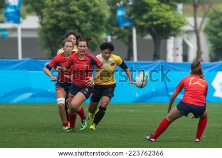 NANJING, CHINA-AUGUST 19: China Rugby Team (yellow) plays against Spain Rugby Team (red) during Day 3 match of 2014 Youth Olympic Games on August 19, 2014 in Nanjing, China. China wins 45-0.