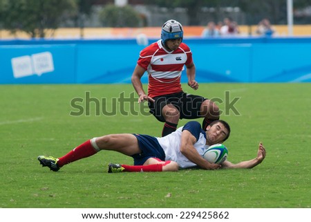 NANJING, CHINA-AUGUST 19: French Rugby Team (white) plays against Japan Rugby Team (red) on Day 3 match of 2014 Youth Olympic Games on August 19, 2014 in Nanjing, China. France wins 28-7.